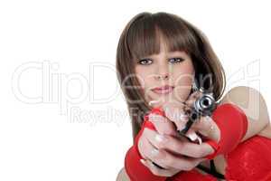 Portrait of the young woman with a pistol
