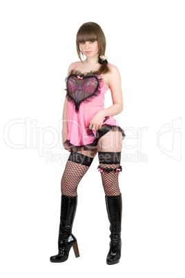 Playful girl in a pink dress and black boots