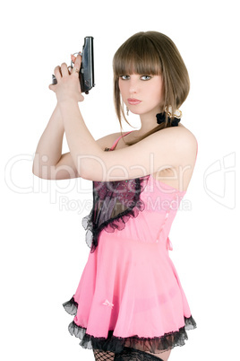 Pretty girl in a pink dress with pistol
