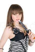 Beautiful girl in a striped dress with a knife