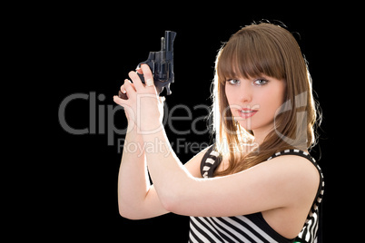 Beautiful young woman with pistol. Isolated on black