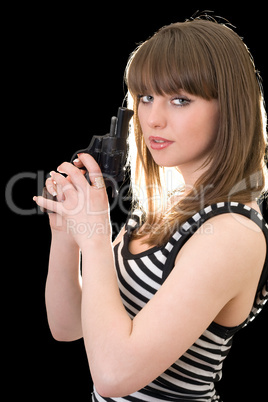 Attractive young woman with pistol. Isolated on black