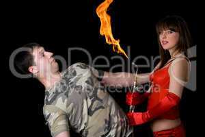 Young woman with a gas torch and scared man. Isolated