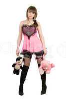Pretty girl in a pink dress with plush toys