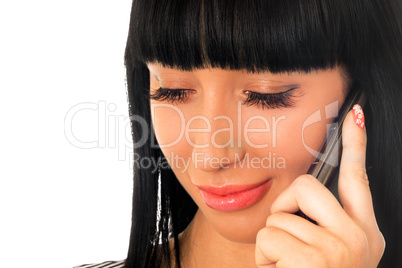 Portrait of the pretty girl speaking on the phone