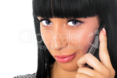 Portrait of the beautiful girl speaking on the phone