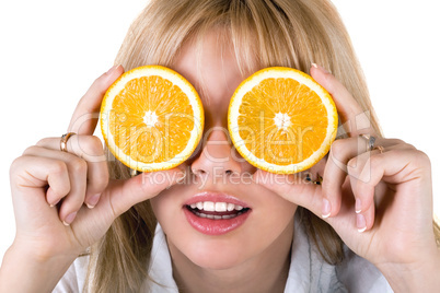 Portrait of the funny young woman with oranges. Isolated