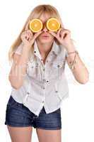 Portrait of the funny girl with oranges. Isolated