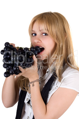 Portrait of the girl eating grapes. Isolated