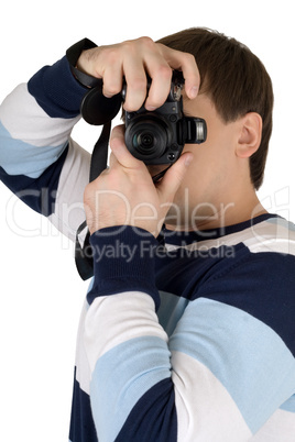 Young man with a digital camera. Isolated on white