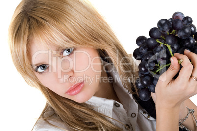 Portrait of the girl with grapes cluster. Isolated