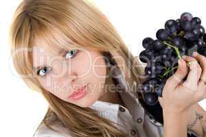 Portrait of the girl with grapes cluster. Isolated