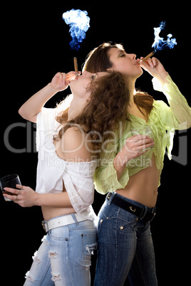 Two girlfriends with a glass of brandy and cigars