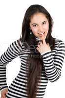 Smiling playful girl in striped blouse. Isolated