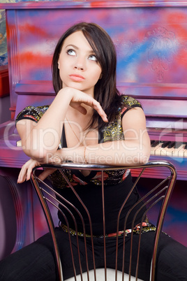 Pretty young woman sitting on a chair