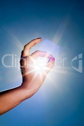 hand and sun