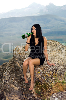 Young woman with a champagne bottle