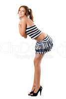 Playful woman in a striped skirt