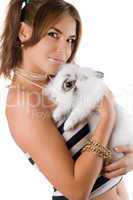 Beautiful young woman with rabbit