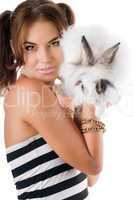 Lovely young woman with little white rabbit