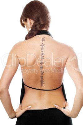 Young woman with a tattoo on her back