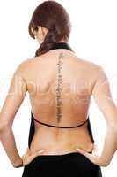 Young woman with a tattoo on her back