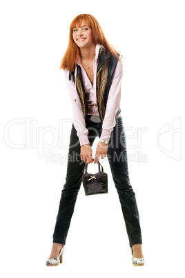 Joyful red-haired young woman with handbag