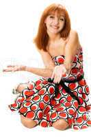 Playful red-haired girl in a dress