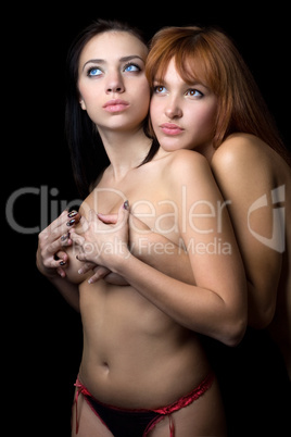 Two young topless women