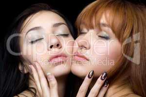Two women with closed eyes