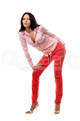 Playful young brunette in red jeans