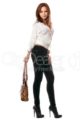 Girl in black tight jeans with a handbag