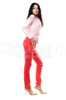 Attractive young brunette in red jeans