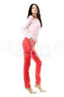 Beautiful young brunette in red jeans