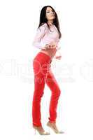 Playful young brunette in red jeans