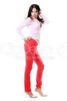 Pretty young brunette in red jeans