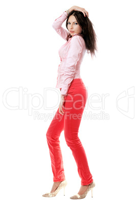 Attractive young woman in red jeans