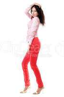 Attractive young woman in red jeans