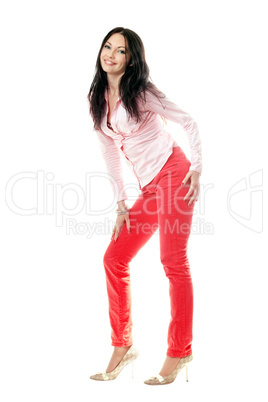 Smiling brunette in red jeans