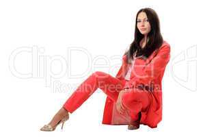 Pretty young woman in red suit. Isolated