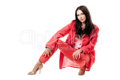 Beautiful young woman in red suit. Isolated