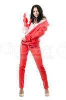 Cheerful young brunette in red suit. Isolated