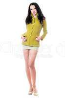 Woman posing in yellow knitted jacket