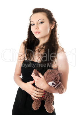 Playful woman taking teddy-bear