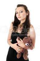 Playful woman taking teddy-bear