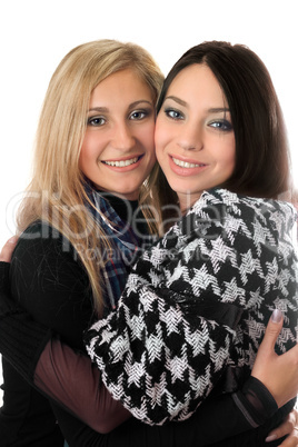 Portrait of two attractive girls embracing