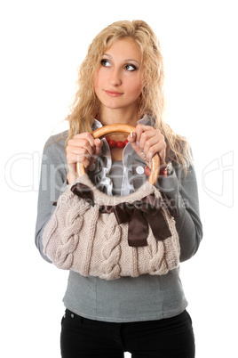 Portrait of attractive blonde with a handbag