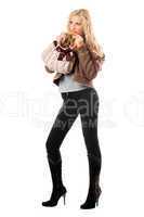 Pretty playful young blonde with a handbag. Isolated