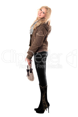 Smiling young blonde with a handbag. Isolated
