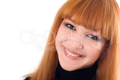 Portrait of the smiling redheaded woman